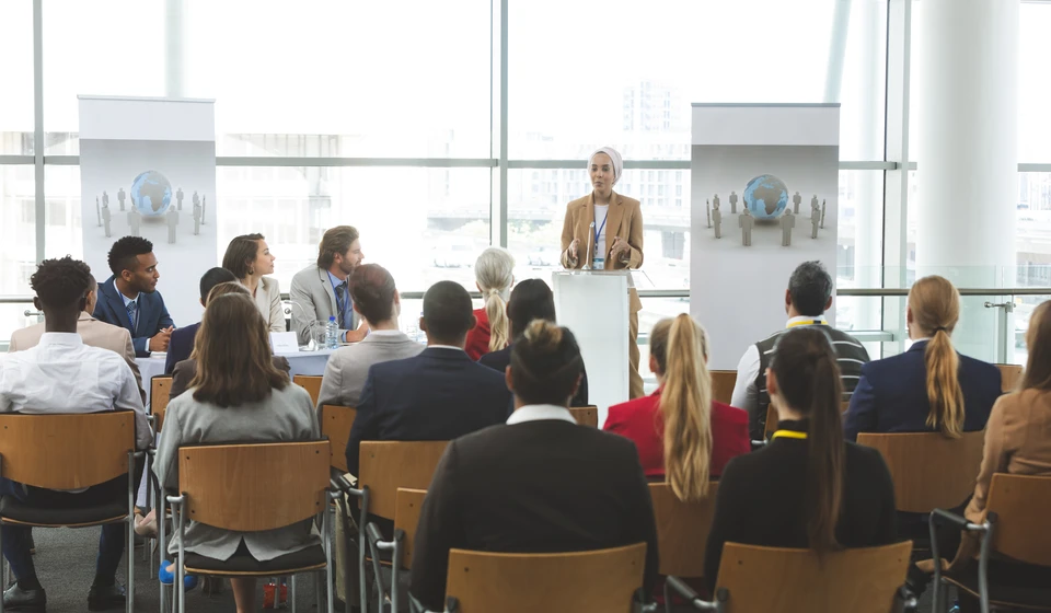 female-speaker-speaking-in-a-business-seminar-in