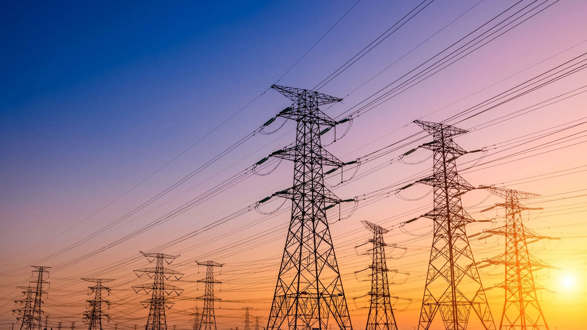 high voltage power lines at sunset