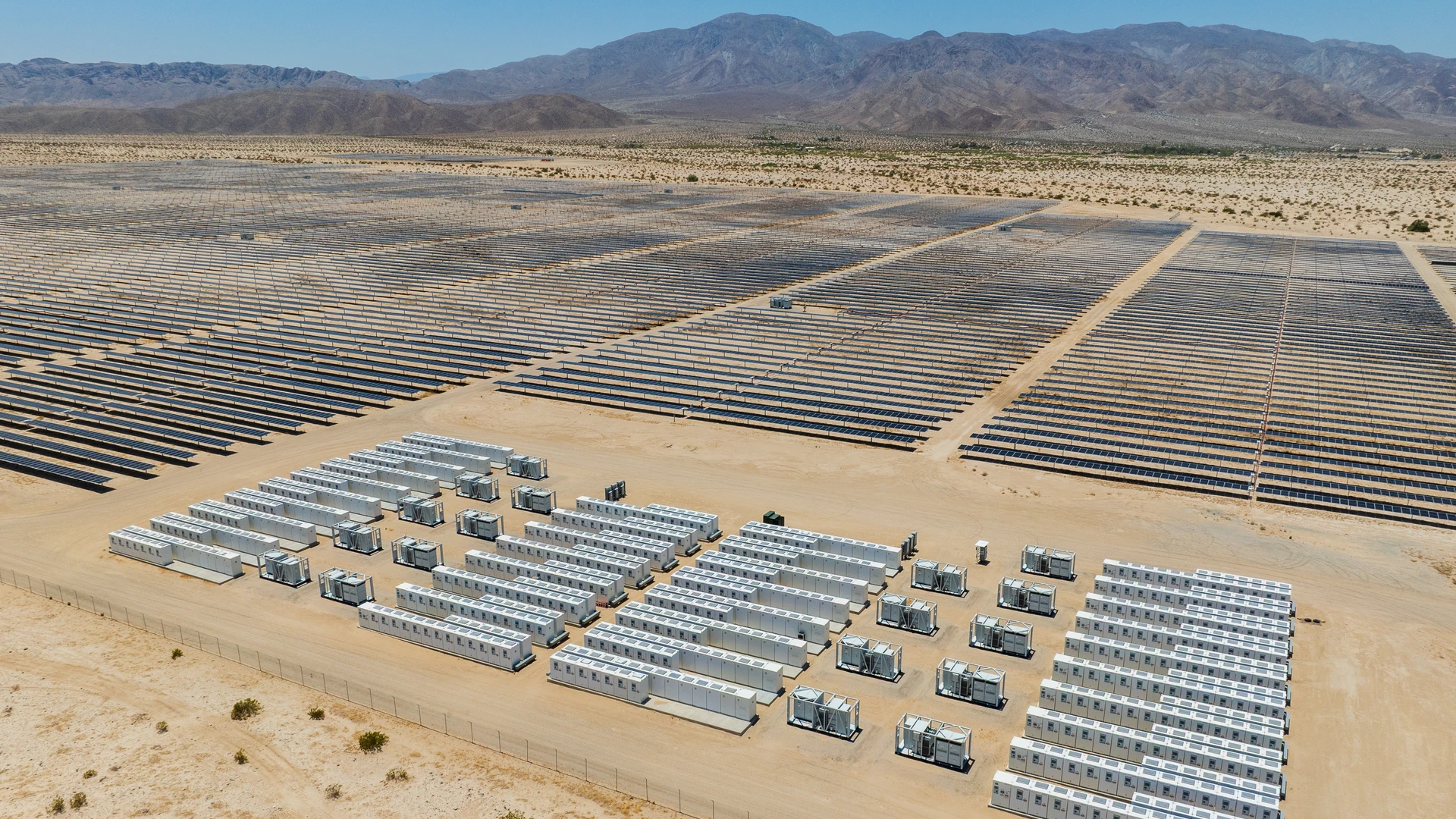 Large battery storage and solar site with mountains in distance