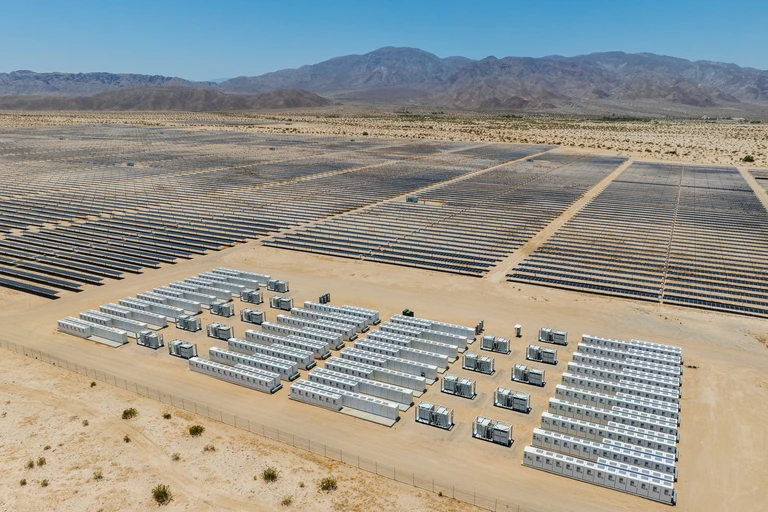 Large battery storage and solar site with mountains in distance
